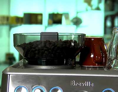 An image of Breville BES870XL's conical burr grinder and 8-ounce bean hopper