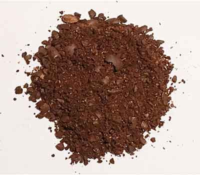 An image of a blade grinder's inconsistent coffee grounds