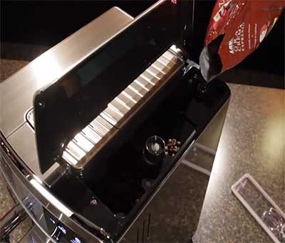 An image of Saeco HD8954/47's ceramic burr grinder and 12-ounce bean hopper