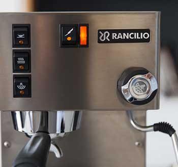 An image of Rancilio Silvia's control knobs, levers, switches and indicator lights