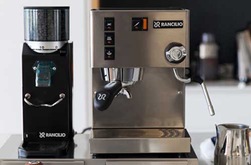 Front view image of Rancilio Silvia with a coffee grinder 