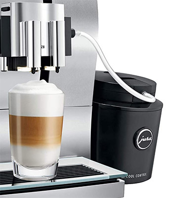 Jura Z8 Automatic Coffee Machine with a glass filled with coffee and attached milk frother to the right